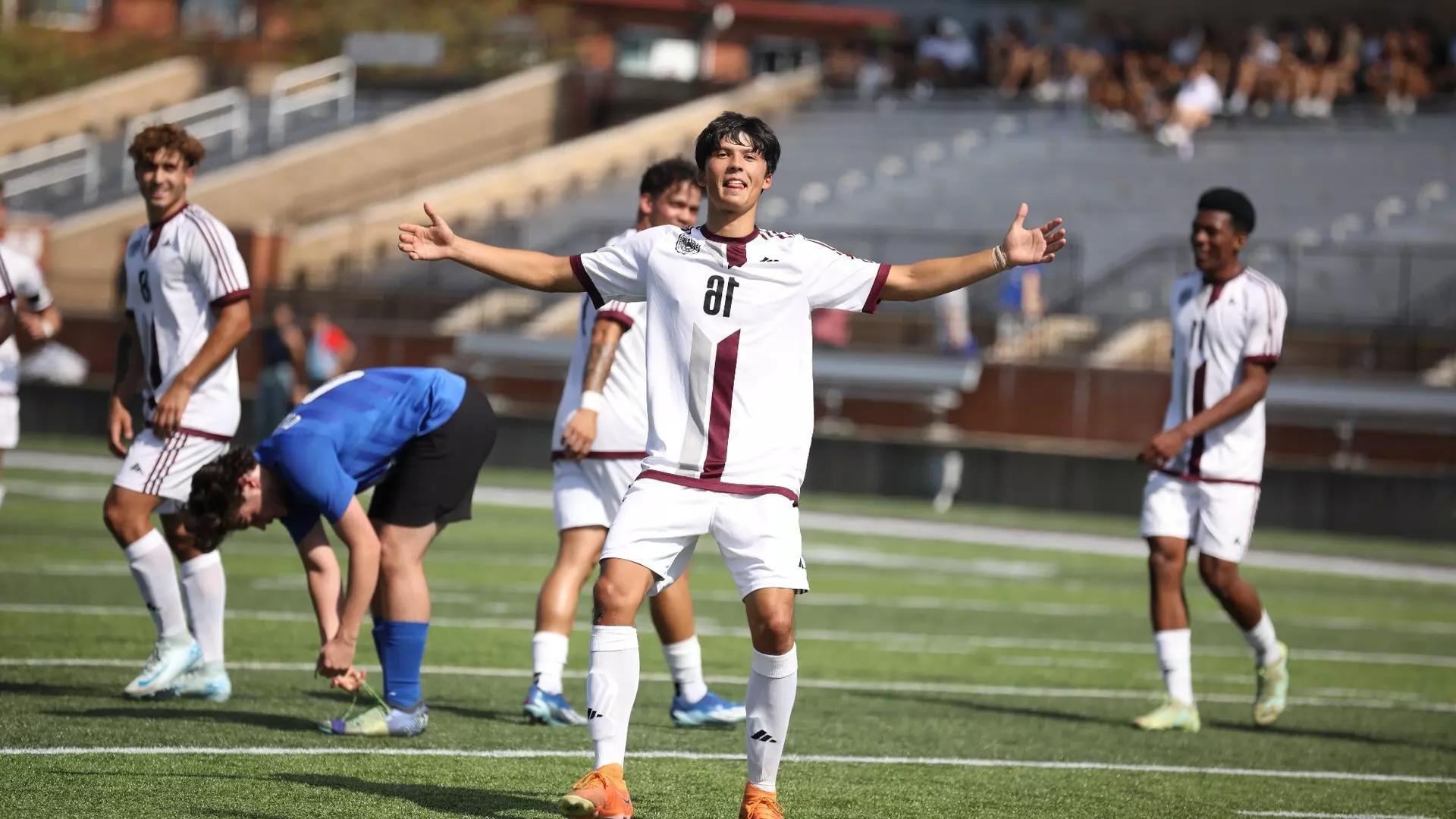 Men's soccer team celebrates after a successful home game